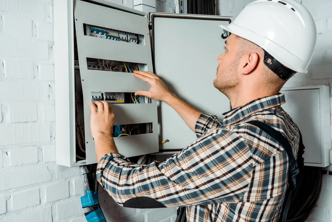 Electrician performing electrical panel upgrade in Duncan OK